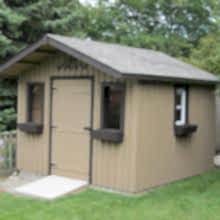 10 x 10 high board and batten with a 2 foot gable overhang.
